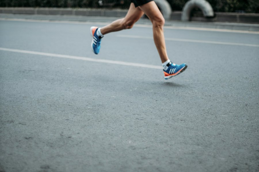 Runner sprinting on a city road