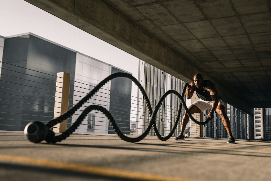 Athlete training with battle ropes